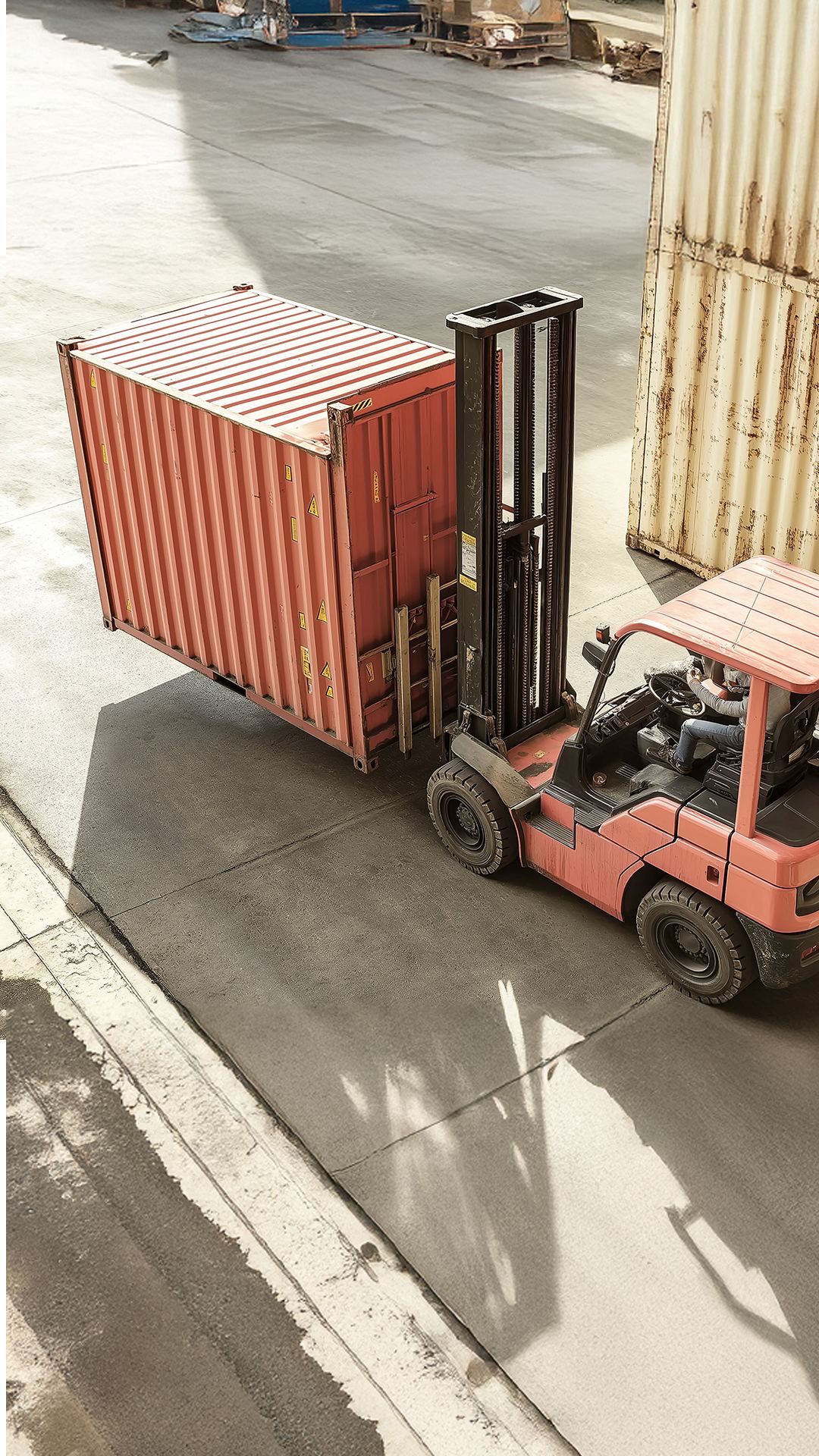 Forklift moving a storage container in the secure yard